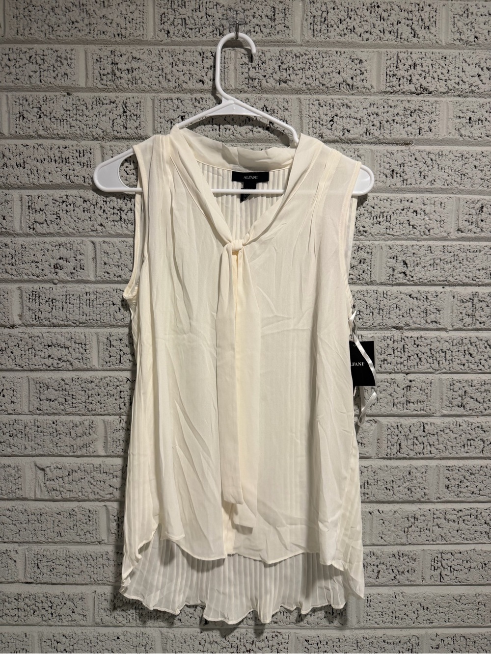 London Style Cream Sleeveless Tie-Front Pleated Hem Blouse